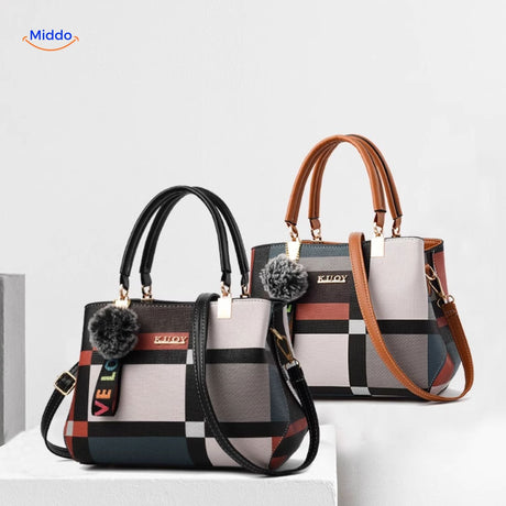 Tote handbag available in black and brown color options.