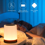 Touch control night light in bedroom providing adjustable colored ambiance.