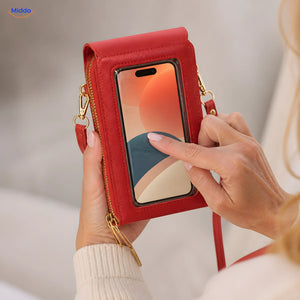 Using a phone through the transparent window of the red TouchScreenGo bag