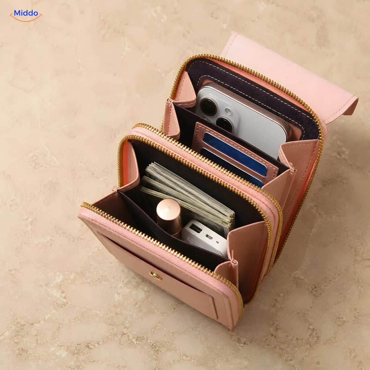 Open pink TouchScreenGo bag with compartments for a phone cards and cash