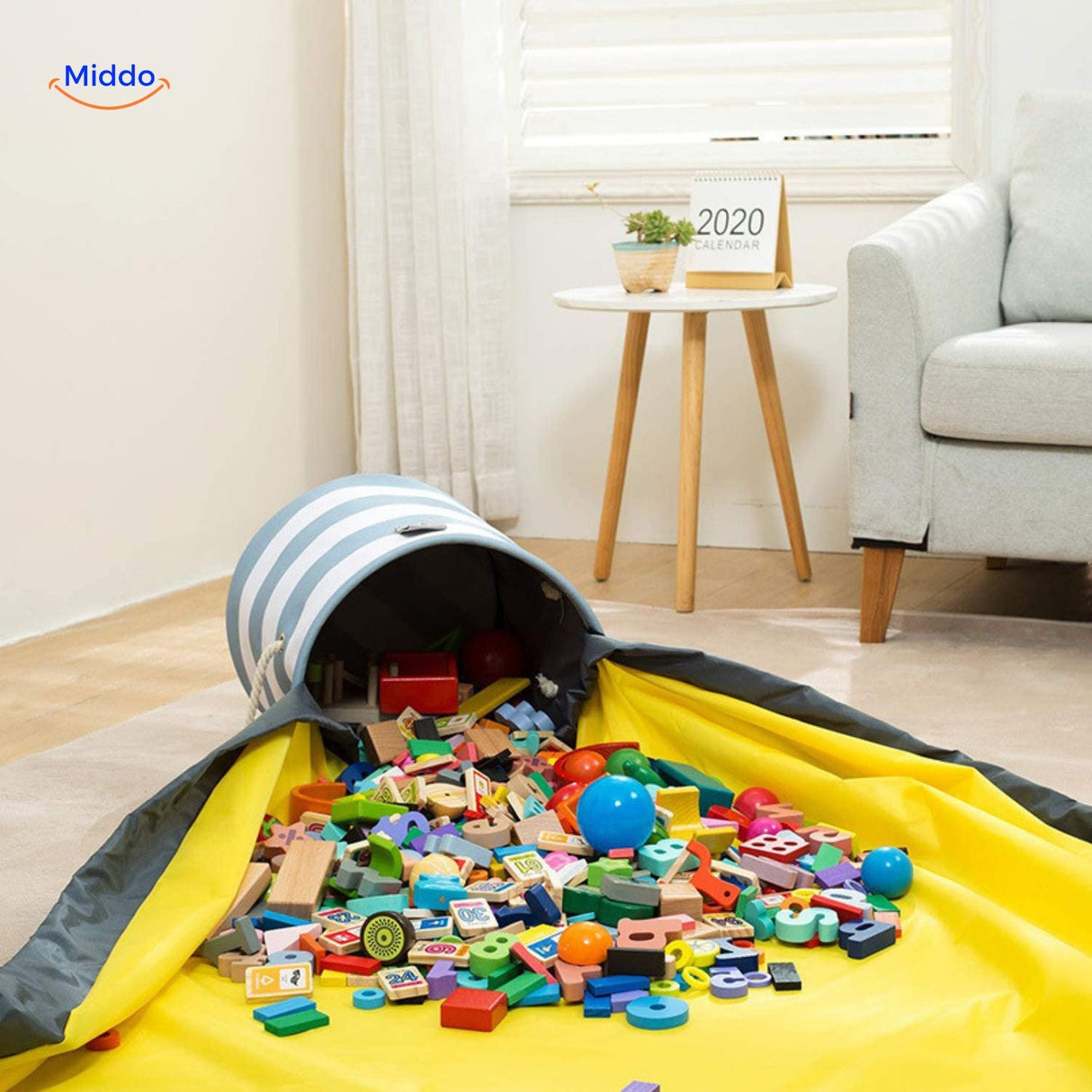 Toy storage bag filled with colorful blocks displayed in a living room setting.