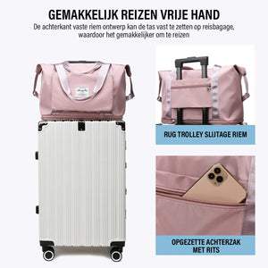 Expandable travel bag positioned on top of luggage for convenient hands-free carrying.