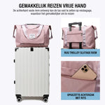 Expandable travel bag positioned on top of luggage for convenient hands-free carrying.