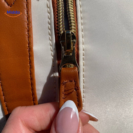 High-quality zipper hardware and secure closure mechanism.
