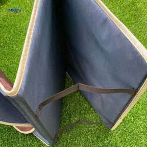 Compact travel prayer mat with built-in carry handle for easy transport on the go.