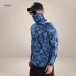UPF50+ fishing shirt in blue camouflage worn with black cap and sunglasses
