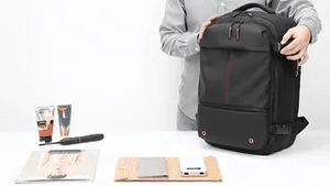 VacuPro compression backpack with multiple organizer pockets and accessories.
