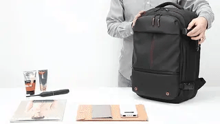 VacuPro compression backpack with multiple organizer pockets and accessories.