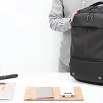 VacuPro compression backpack with multiple organizer pockets and accessories.