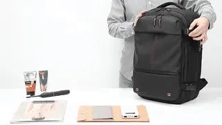 VacuPro compression backpack with multiple organizer pockets and accessories.