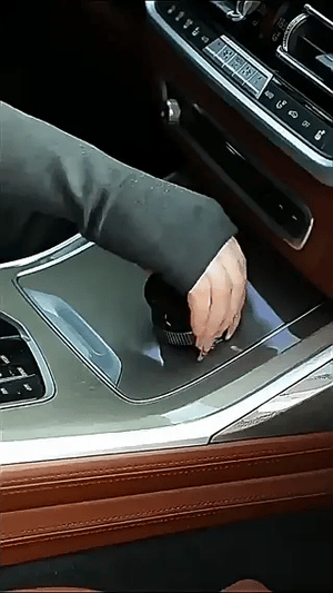 Step-by-step installation of vacuum suction phone holder onto car dashboard using the grip dial