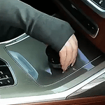 Step-by-step installation of vacuum suction phone holder onto car dashboard using the grip dial
