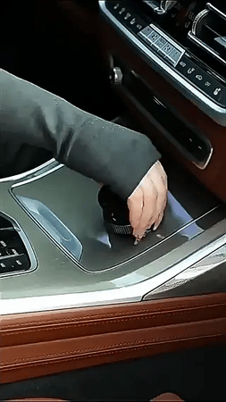 Step-by-step installation of vacuum suction phone holder onto car dashboard using the grip dial