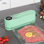 FoodSeal cordless vacuum sealer with digital display sealing fresh meat.