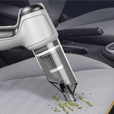 VacuumX PRO cordless vacuum being used to clean car interior and seats.