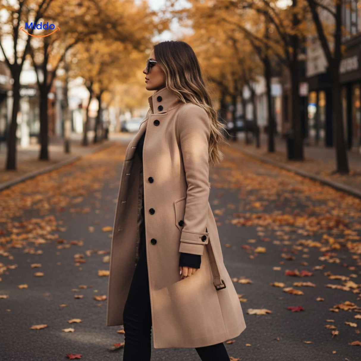 Beige button-front Veloura coat with high collar and black buttons.