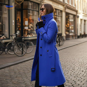 Blue button-front Veloura coat paired with sunglasses in casual style.