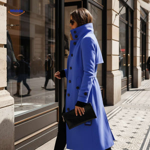 Women's blue Veloura button-front coat displayed at shop window.