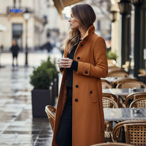 Stylish Veloura button-front women's coat worn at outdoor café setting.