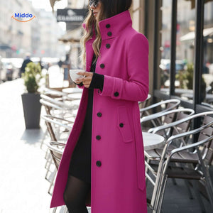Women's pink Veloura button-front coat at café daytime setting.