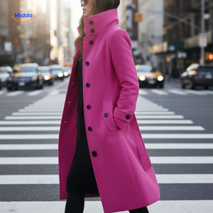 Pink button-front Veloura coat in elegant street style ensemble.