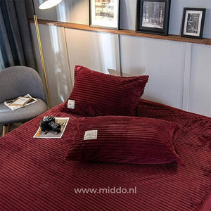 Bordeaux velvet fleece pillowcases pair with matching duvet collection.