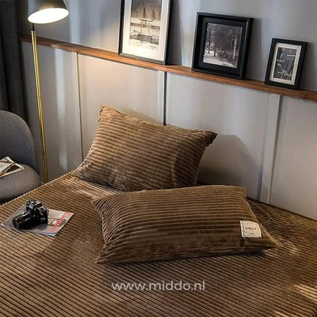 Brown velvet fleece pillowcases provide matching comfort bedding.
