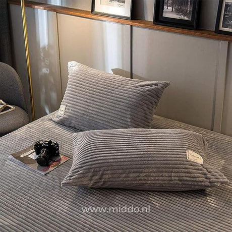 Pair of grey velvet fleece pillowcases match your cozy duvet perfectly.