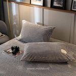 Pair of grey velvet fleece pillowcases match your cozy duvet perfectly.