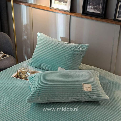 Jade green velvet fleece pillowcases add elegance to any bedroom.