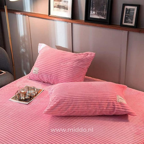 Soft pink velvet fleece pillowcases coordinate with duvet options.