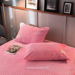 Soft pink velvet fleece pillowcases coordinate with duvet options.