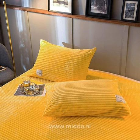 Yellow velvet fleece pillowcases coordinate with duvet cover collection.