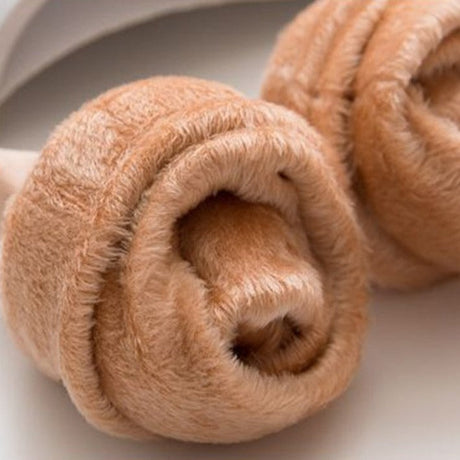 Rolled velvet socks displaying compact form and quality.