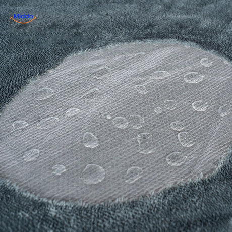 Waterproof pet blanket with cozy fleece lining for full moisture protection.