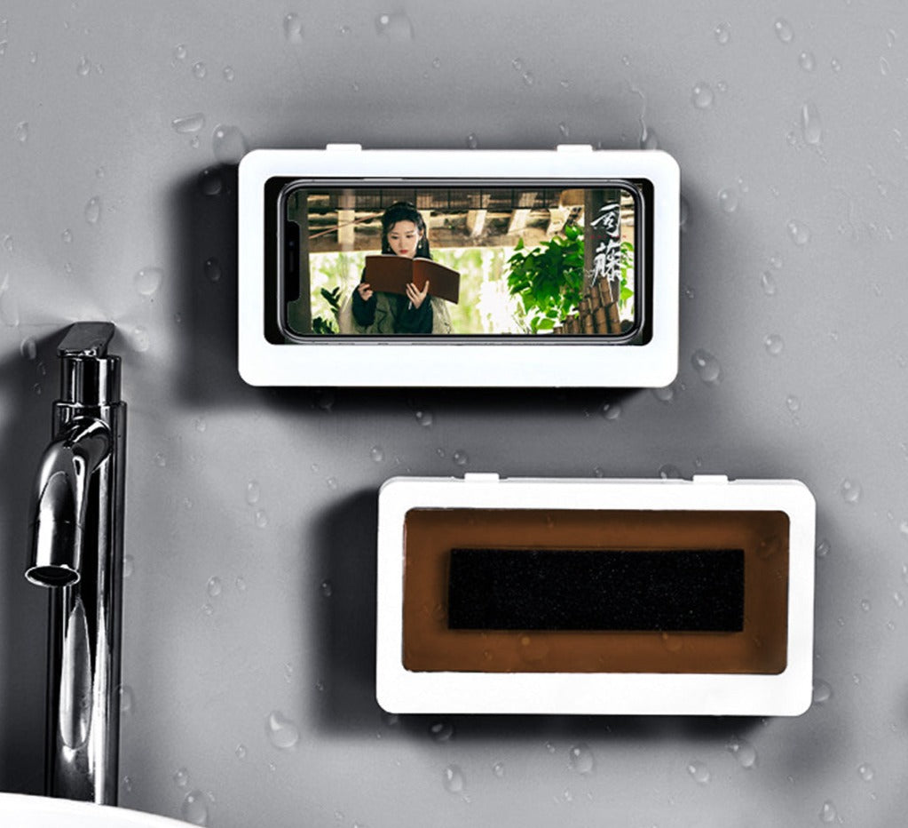 Waterproof shower phone holder with adhesive mounting on bathroom wall.