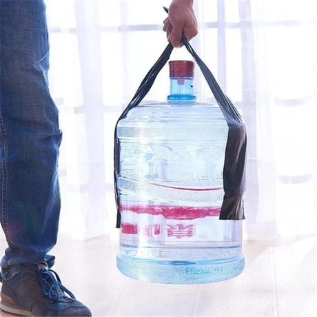 Waterproof tape securing a water bottle in hands during outdoor use.