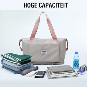 Gray waterproof expandable bag with comfortable backpack straps.