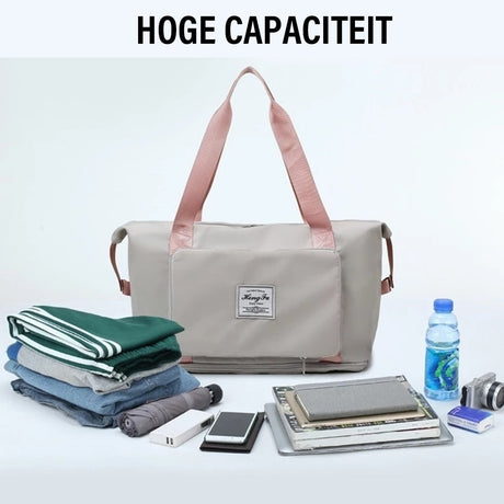 Gray waterproof expandable bag with comfortable backpack straps.