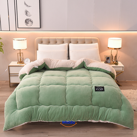 ComfortLux green and white wool-velvet weighted blanket combining natural colors and warmth.