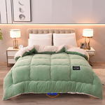 ComfortLux green and white wool-velvet weighted blanket combining natural colors and warmth.