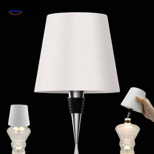 White rechargeable dimmable bottle lamp in modern minimalist style.