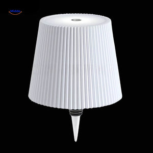 White textured finish rechargeable bottle lamp with soft ambient lighting.