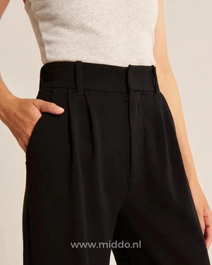 Wide-leg trousers in black showcasing effortless contemporary style and comfort.