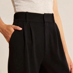 Wide-leg trousers in black showcasing effortless contemporary style and comfort.