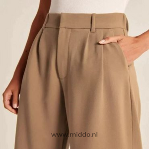Brown wide-leg trousers offering warm neutral tone for versatile everyday wardrobe.