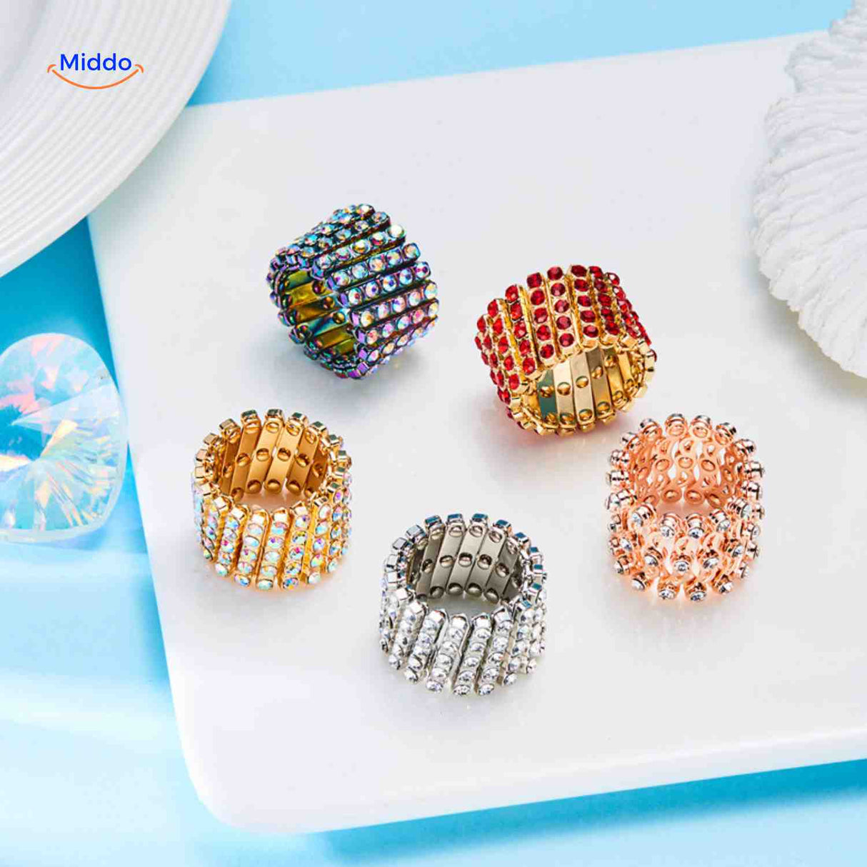 Wide adjustable rings with crystal rhinestones shown as a coordinated set.