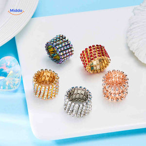 Wide adjustable rings with crystal rhinestones shown as a coordinated set.