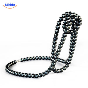 Wine holder embellished with dark pearl bead accents.