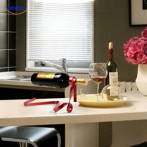 Detailed wine holder display with red ribbon design.